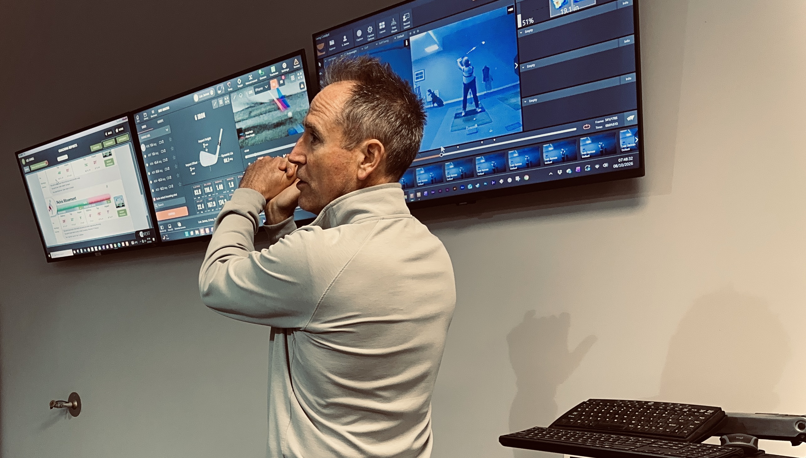 Chris Brook analysing a swing in his performance studio
