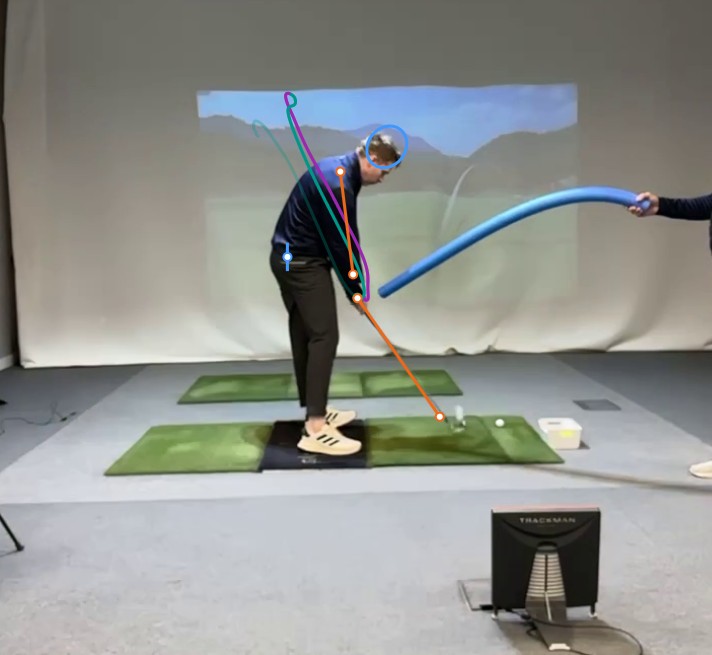 Drill image through impact showing the student striking the ball with the new perceptual route.