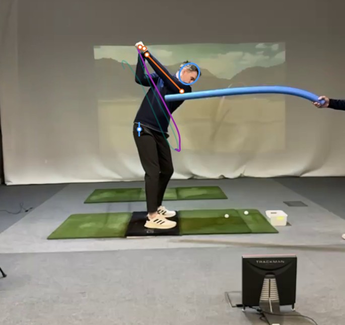 Top of drill setup with foam noodle positioned to block the student's over-the-top hand path.